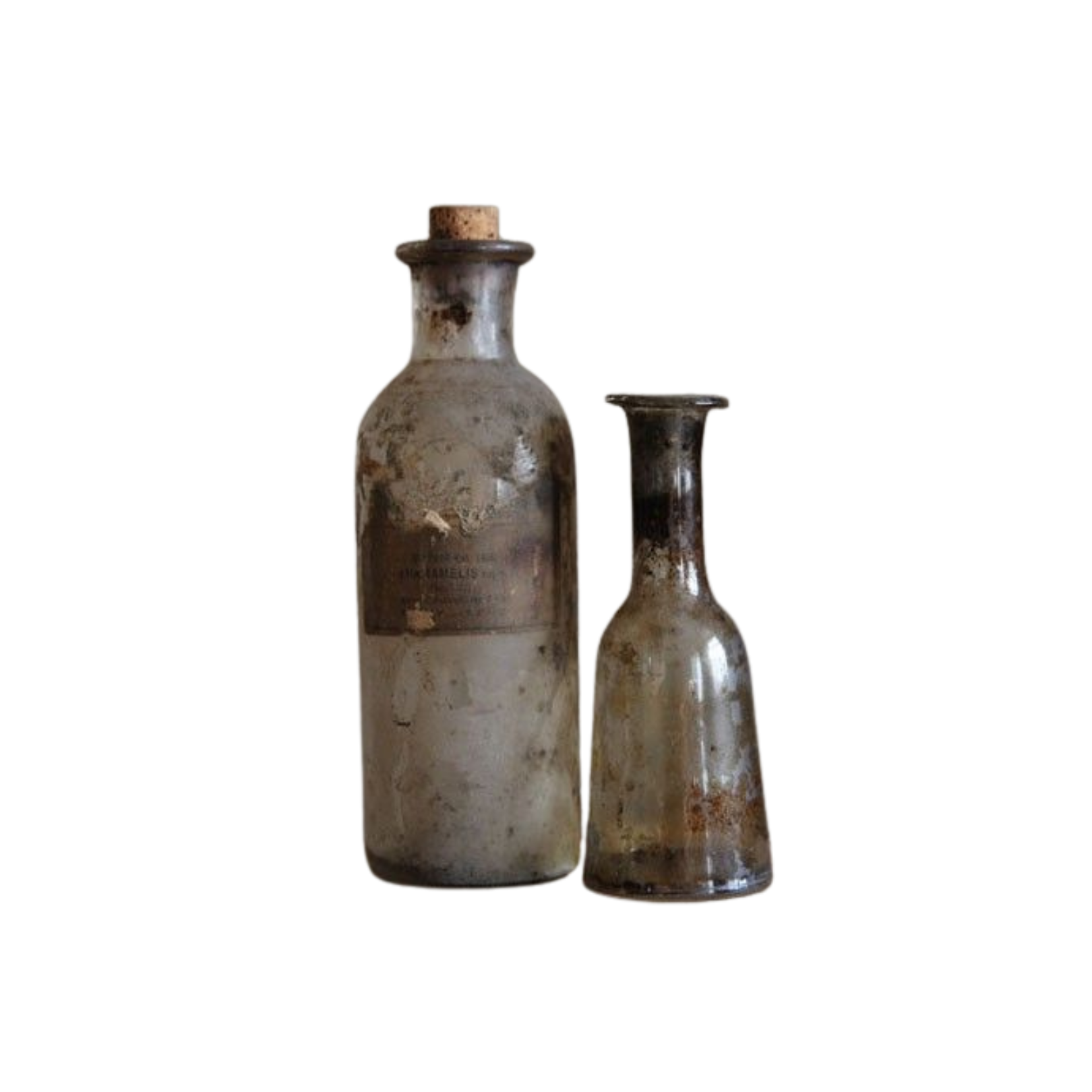 two dirty bottles with writing on them