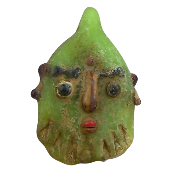 a strange green head